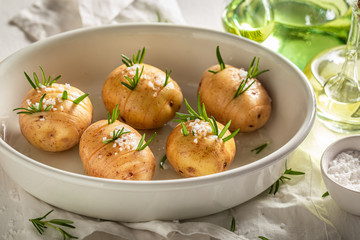 Ingredients for tasty Hasselback made of herbs and salt
