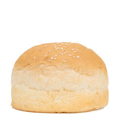 Fresh loaf of bread for a hamburger close-up on a white isolated background