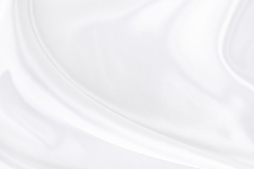 White gray satin texture that is white silver fabric silk background with beautiful soft blur...