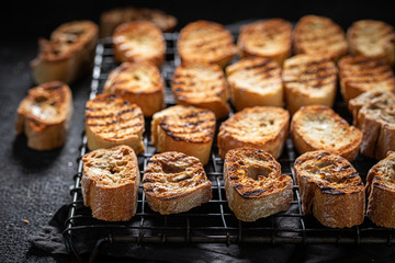 Hot toasted wholegrain bread on a cooling sheet