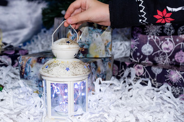 Children's pens hold a festive flashlight. Selective focus.