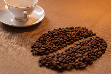 Coffee beans scattered in the form of grain