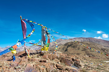 Himachal Pradesh, India - Sep 03 2019 - Tibetan Prayer Flag at Kunzum Pass (Kunzum La) - Chandra Taal (Moon Lake) Trekking course in Lahaul and Spiti, Himachal Pradesh, India.