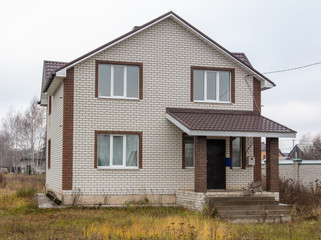 Obraz premium Brick cottage in the village