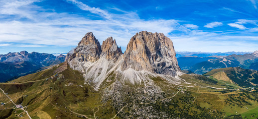 Aerial panorama of Langkofel Group, Grohmannspitze mountain, Fuenffingerspitze mountain and Langkofel Mountain in Italy