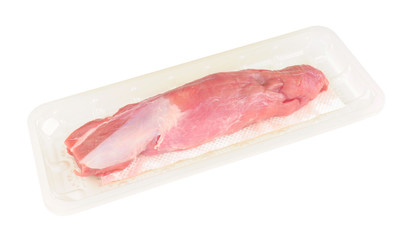 Raw pork loin in plastic packaging tray isolated on a white background
