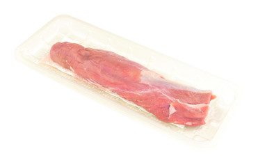 Raw pork loin in plastic packaging tray isolated on a white background