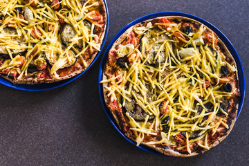 vegetables pizzas with vegan cheddar topping