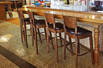 Fototapeta na wymiar studded brown bar stool