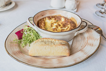 Baked omelet for breakfast with cutlery on the table. Livestyle.