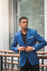 handsome young african man in a blue jacket