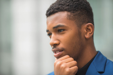 handsome young african man in a blue jacket