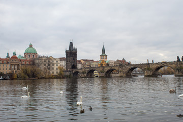 Fototapeta na wymiar Cityscape of the Czech capital Prague and the Vltava river. View of Charles Bridge and Prague Castle on Christmas Eve.