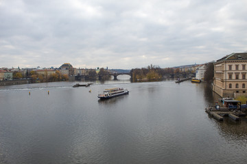 Fototapeta premium Cityscape of the Czech capital Prague and the Vltava river. View of Charles Bridge and Prague Castle on Christmas Eve.