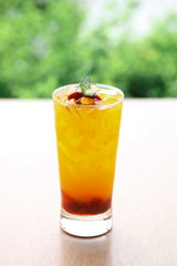 Fresh orange juice soda with strawberry syrup