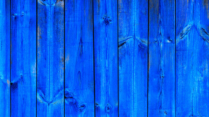 Background blue textured modern trend color, wooden planks vertical. Old ragged wooden blue boards, texture.