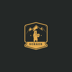 Classic and luxurious logo design template. Bear with shield in the left paw and three mountain in backward of bear