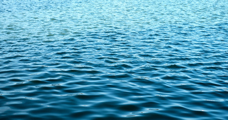 ripples on the marine blue water background