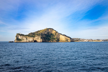 Campi Flegrei, Naples, Campania, Italy: the lighthouse of Cape Miseno seen from the sea. Capo Miseno is the headland on the Bay of Pozzuoli and the Gulf of Naples