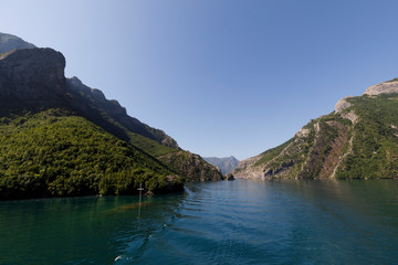 Beautiful landscape with mountains and green forests on a boat trip on the Komani lake in the dinaric alps of Albania