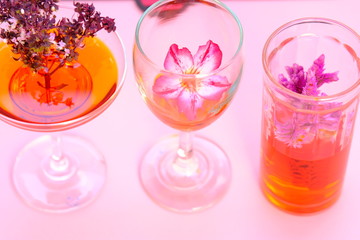 three cocktails and flowers