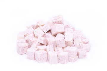 Pile of Taro cut in cubes isolated on white background