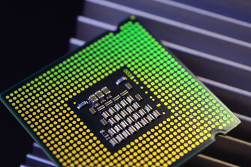 detail of cpu chip processor on aluminum heat sink cooler and lights 