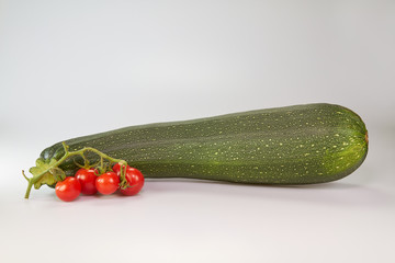 Home grown courgette and small red tomatoes