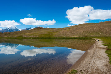 Fototapeta premium Himachal Pradesh, India - Sep 04 2019 - Chandra Taal (Moon Lake) in Lahaul and Spiti, Himachal Pradesh, India. It is part of Ramsar Convention - Chandertal Wetland.