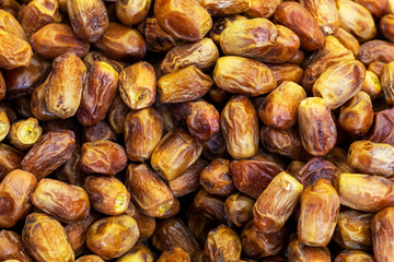 Deglet Noor dates background. Close up, top view.