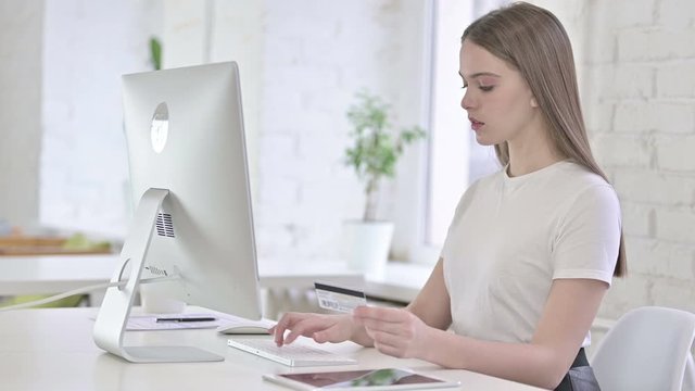 Young Woman reacting to Online Payment Failure on Desktop 