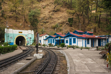 Fototapeta na wymiar Barog, Himachal Pradesh, India - May 2012: The quaint, old Barog railway station on the Kalka-Shimla narrow gauge railway line in Himachal Pradesh, India. 