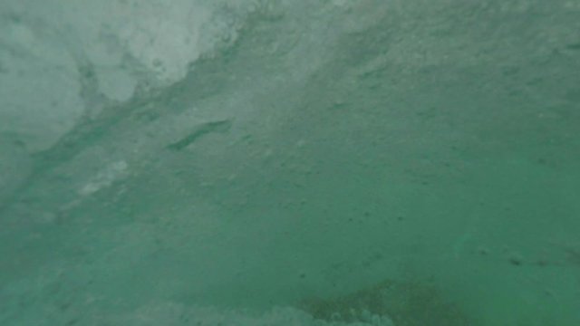 The kite surfer rides the waves of the Atlantic Ocean