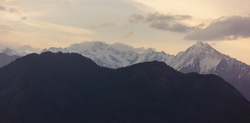 Fototapeta na wymiar A view of the holy snow covered mountain of Shrikhand Mahadev from the village of Sarahan in Himachal Pradesh.