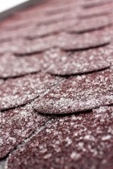 Frost on the roof of the terrace. Ice roof coating. Cold weather. Ice crystals on the roof covering.