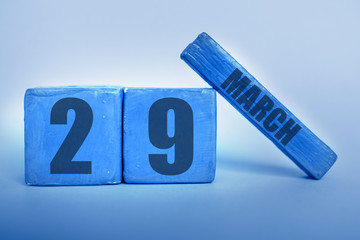march 29th. Day 29 of month, Handmade wood cube calendar with date month and day in trendy classic blue color of the year spring month, day of the year concept