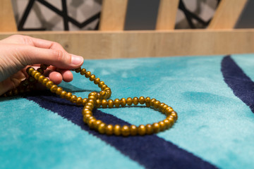 Muslims pray with beads in the Mosque for blessed Friday from Turkey.