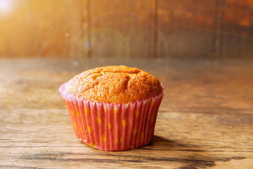 Closeup Thai ancient eggs cupcake put on wooden table and background with sun flare and lens flare.