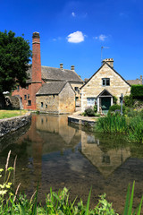 Fototapeta na wymiar Summer view over Cottages and the River Eye, Lower Slaughter village, Gloucestershire Cotswolds, England, UK