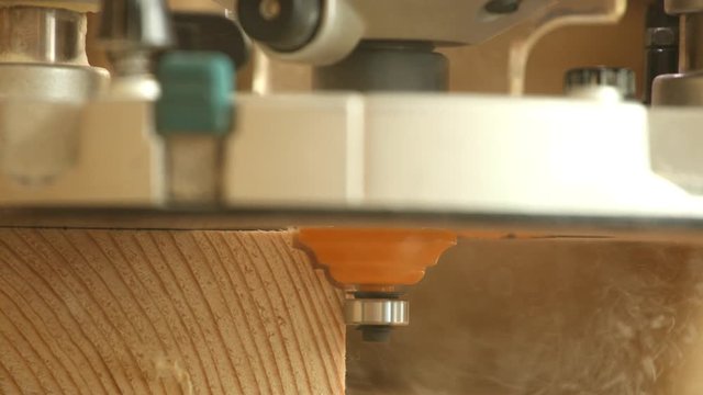 Hand milling router machine milling wood edge close up
