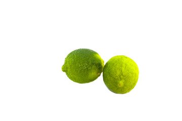 Two limes on a white background
