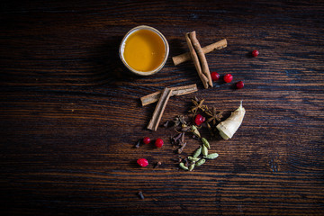 honey cinnamon and ginger on a wooden table