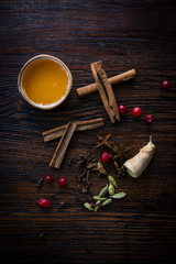 honey cinnamon and ginger on a wooden table