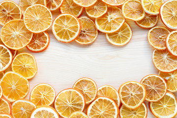 A sliced dry oranges on wooden table, Christmas decoration.