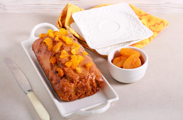 Glazed cake with apricot topping served