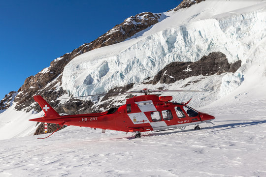 Rescue helicopter on Jungfraujoch glacier