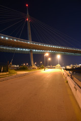 Fototapeta na wymiar Ponte del Mare by Night in the City Illuminated by Lamps
