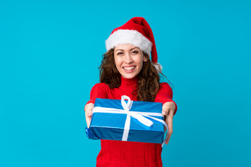 Girl with christmas hat over isolated background