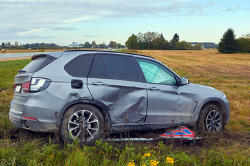 Fototapeta na wymiar Damaged car after accident on a road