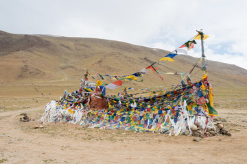 Ladakh, India - Jul 12 2019 - Tibetan prayer flag at Polokongka La Pass in Ladakh, Jammu and Kashmir, India. Polokongka La is situated at an altitude of around 4940m above the sea level.